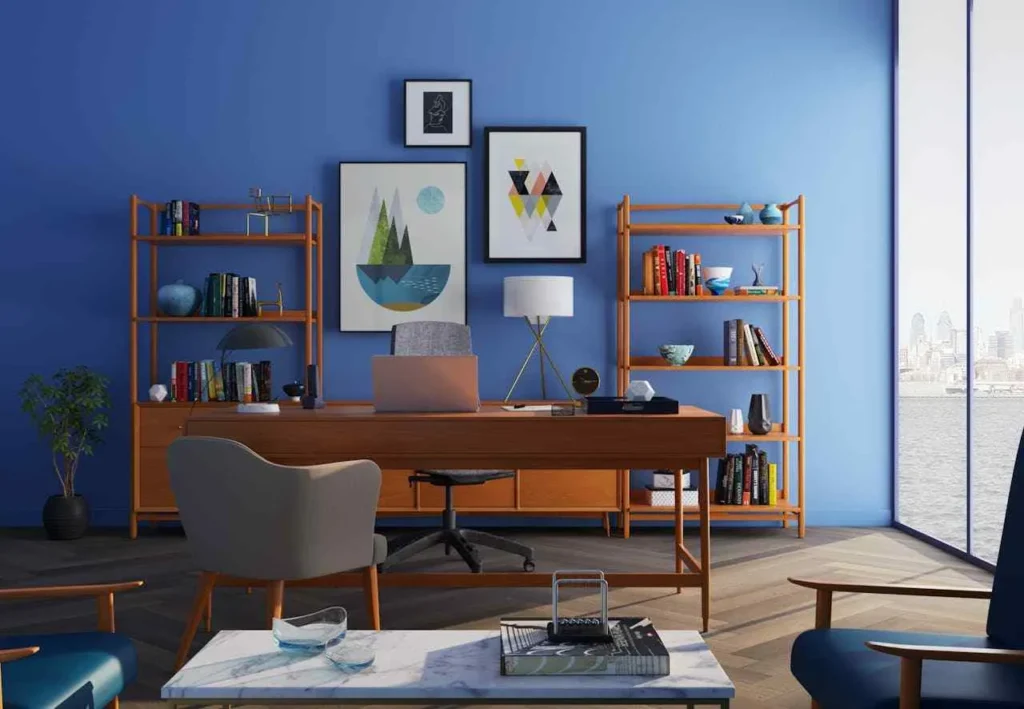 Interior design styles A modern home office with blue walls, wooden desk, and bookshelves. Artworks, books, and decor items add creativity. Large window reveals a cityscape.